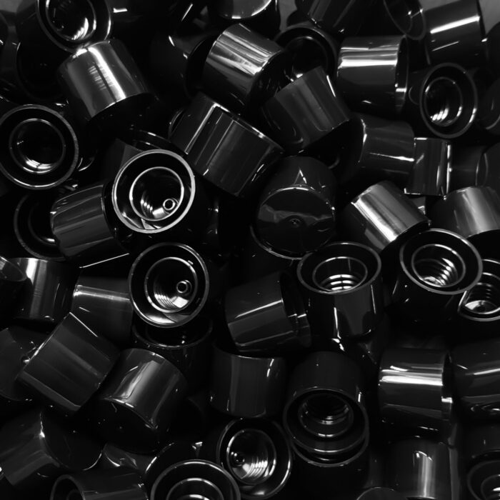 Black,Round,Plastic,Parts,From,Industrial,Plastic,Machines.